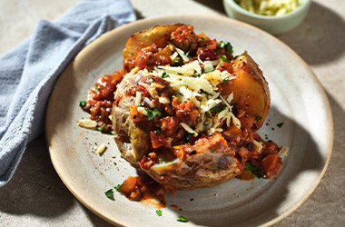 Baked potatoes with speedy chicken chilli