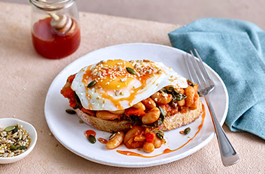 Hearty baked cannellini beans with sriracha hot honey