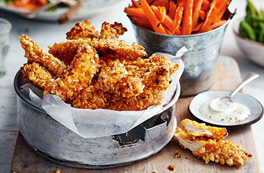Crunchy chicken goujons with carrot 'fries'