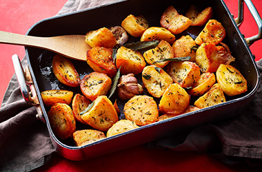 Herby triple-cooked roasties 