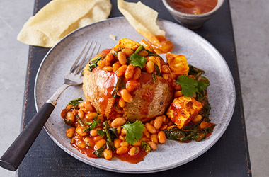 Jacket potatoes with curried beans and paneer