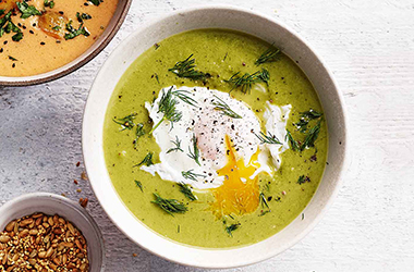 Pea and lettuce soup with poached eggs