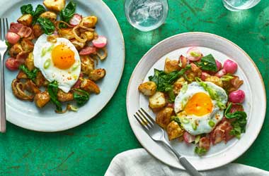 Potato hash with bacon and fried eggs 