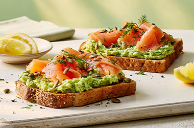 Smashed soya beans and salmon on toast