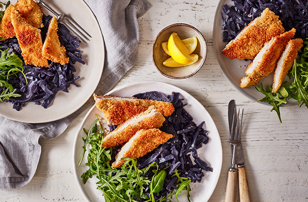 Couscous chicken schnitzel with red cabbage and rocket