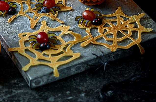 Spider's web pancakes with fruity spiders