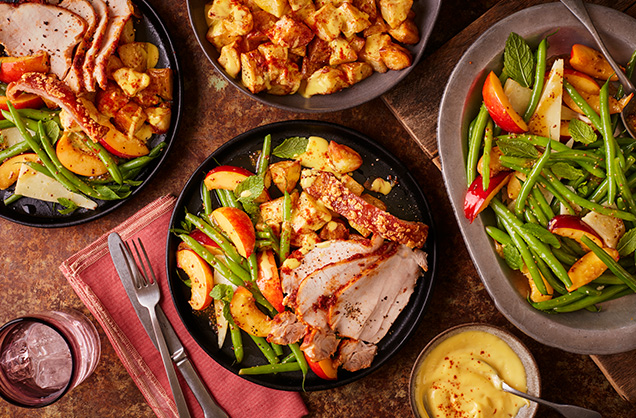 Paprika roast pork with roast potatoes, nectarine salad and saffron aioli